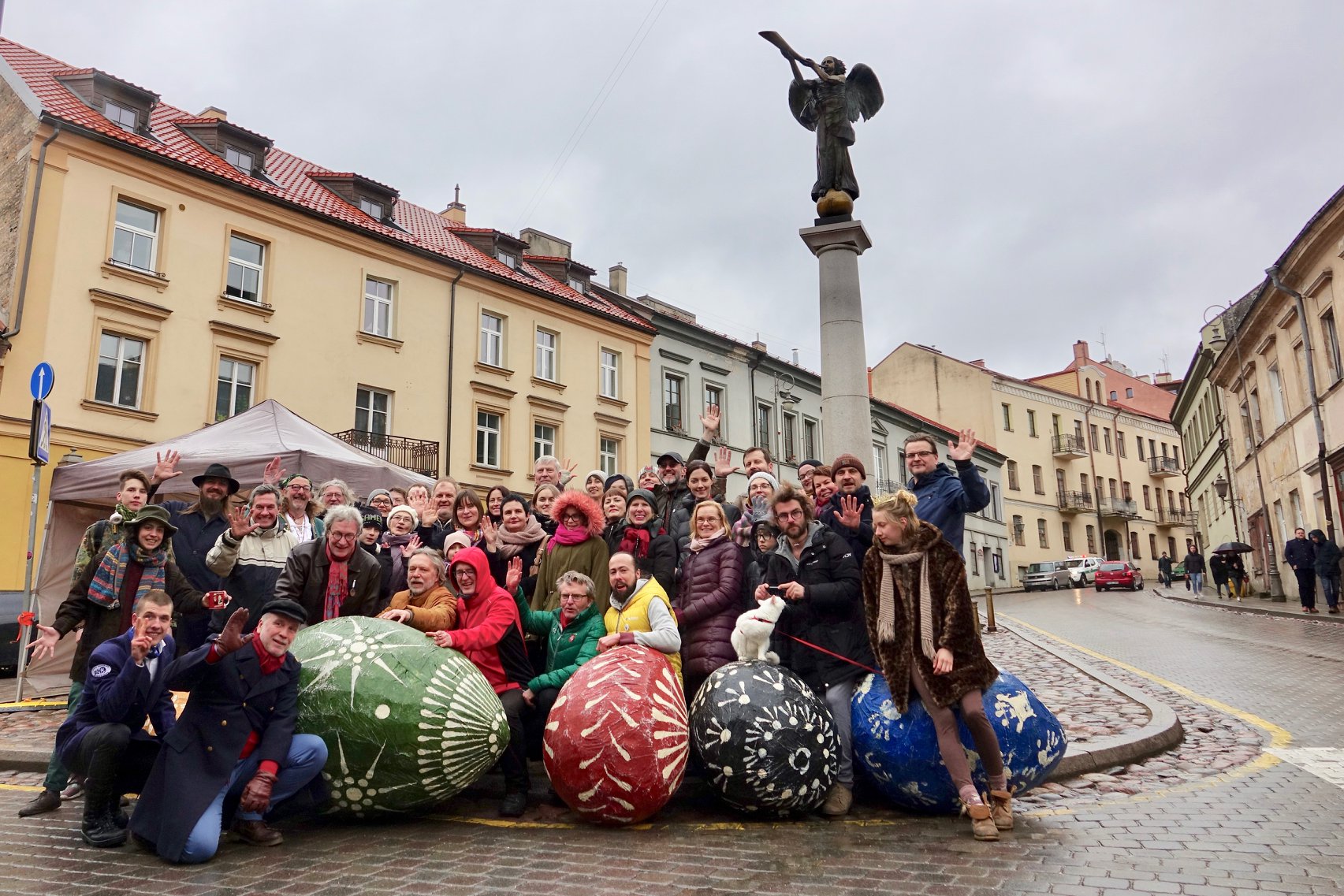 A group of people with massive Easter eggs on Vilnius free walking tour